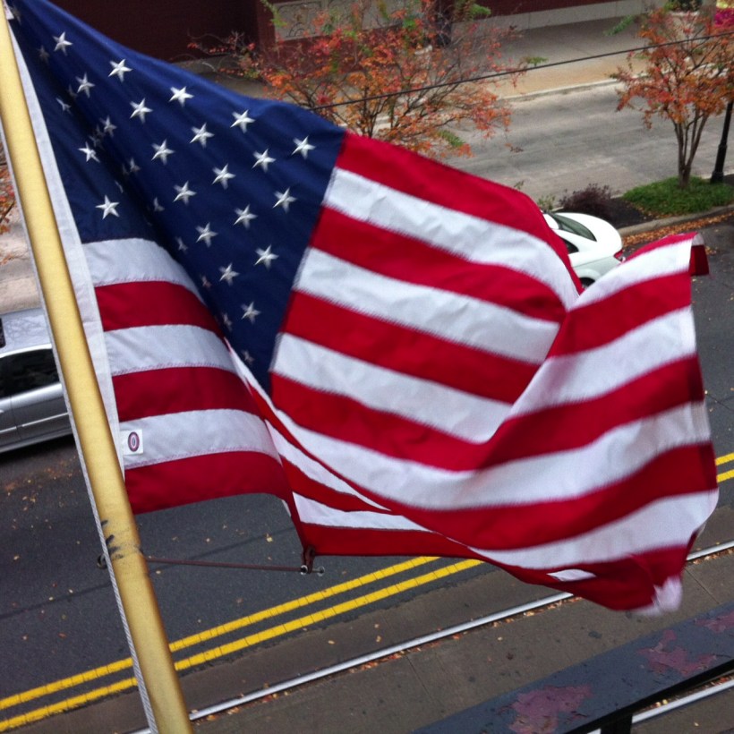 The stars and stripes unfurled from the balcony of the Capital Hotel.